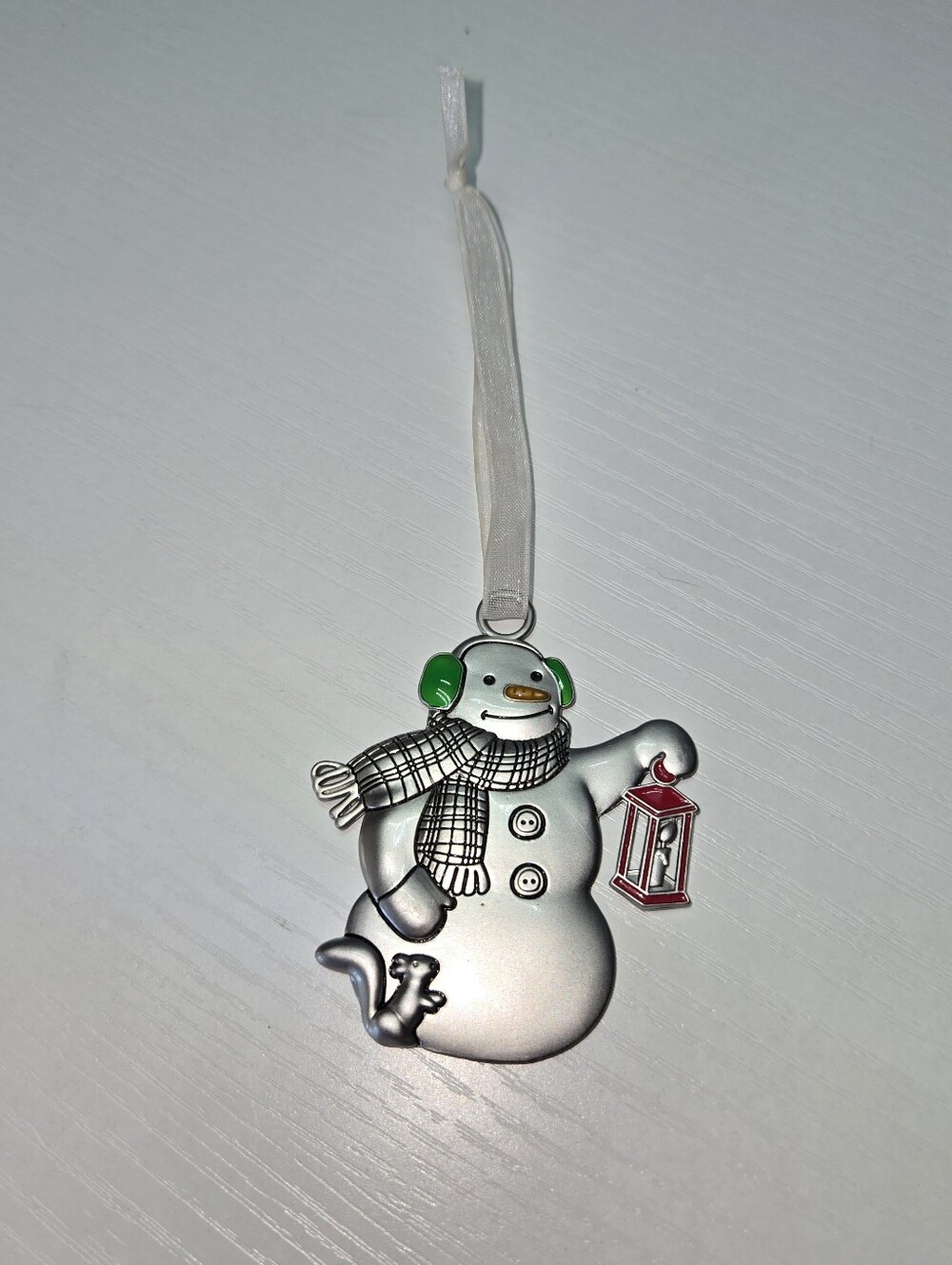 Festive Silver Snowman Ornament with Green Ear Muffs and Red Lantern - Hallmark